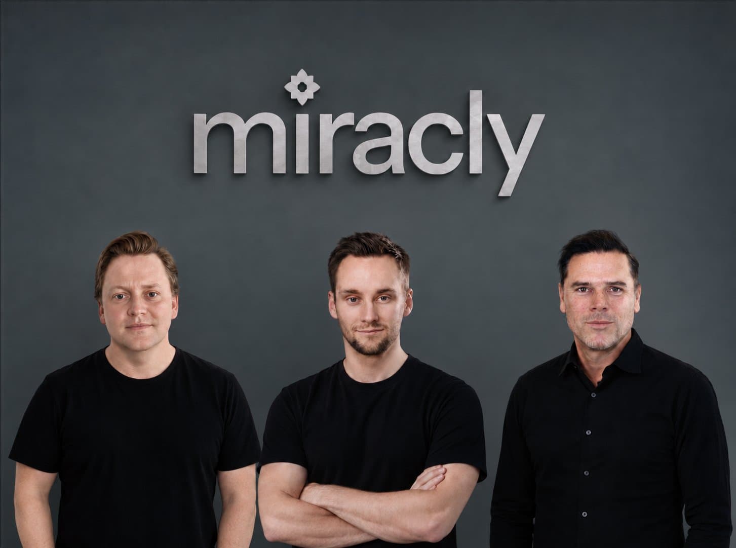 Miracly founders Arvid Lithander, Bjorn Bergstrom and Shannon Cullum in front of the Miracly logo